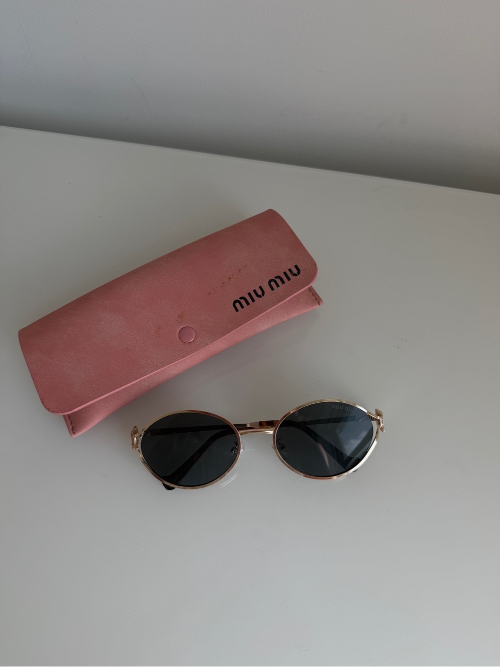 Miu Miu Oval Sunglasses